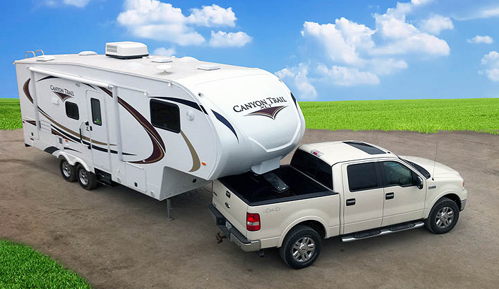 An image of a pickup and Canyon Trail Fifth Wheel from our archives (not currently in production)